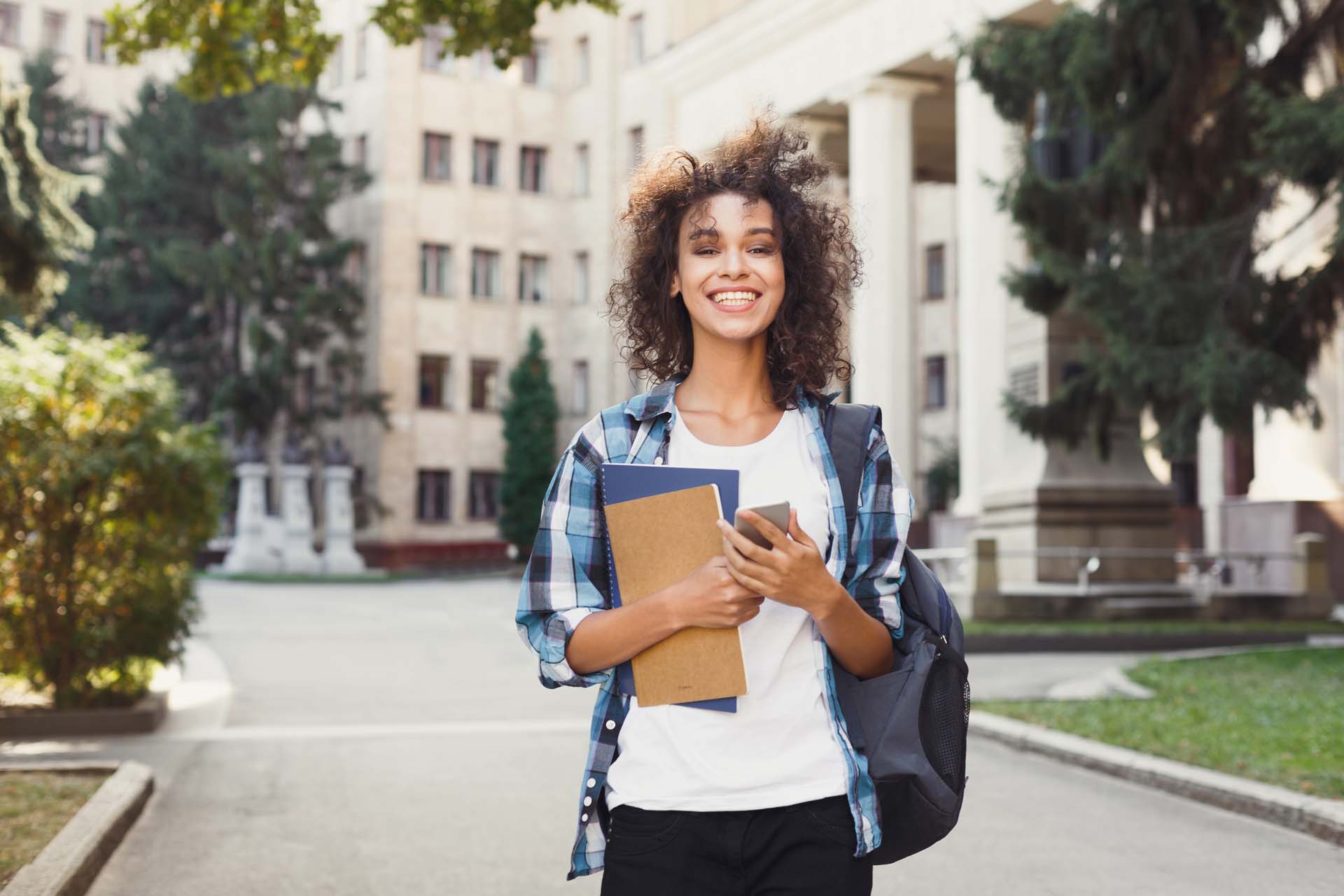 Happy,Smiling,African-american,Student,Girl,With,Backpack,At,University,Background.